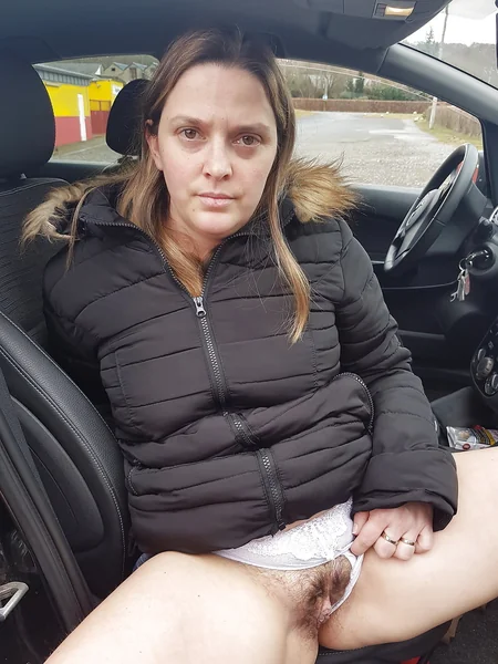 A mature French woman shows off her unshaven pussy