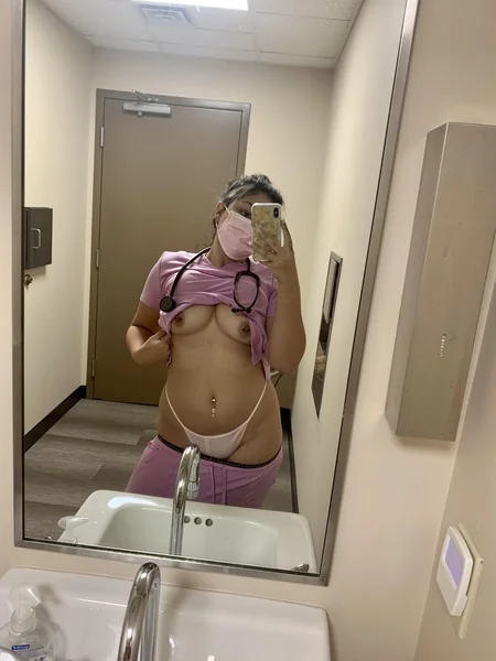 A luscious nurse takes slutty selfies at work photo 19