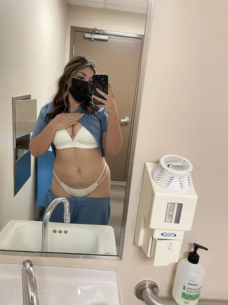 A luscious nurse takes slutty selfies at work photo 2