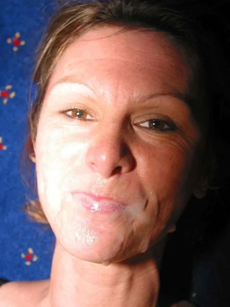 An older woman likes cum on her face photo 11