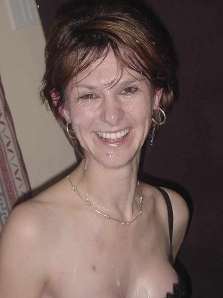 An older woman likes cum on her face photo 13