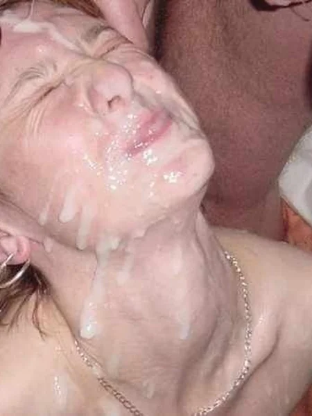 An older woman likes cum on her face photo 16