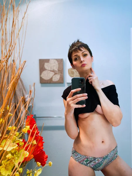 A skinny MILF with saggy tits photo 23